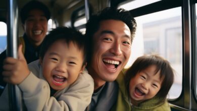 asian dad with his kids riding a transportation